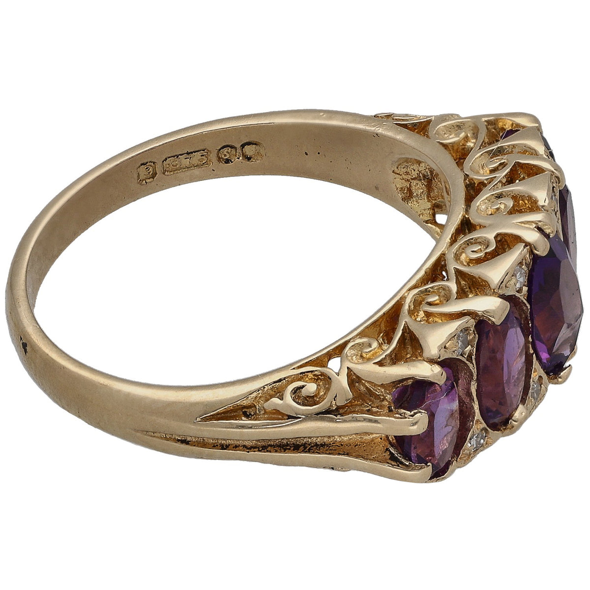 Yellow gold ring with purple amethyst stones and small diamond accents, side view