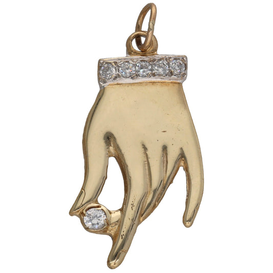 Gold-tone hand-shaped pendant with clear CZ stone row across the cuff