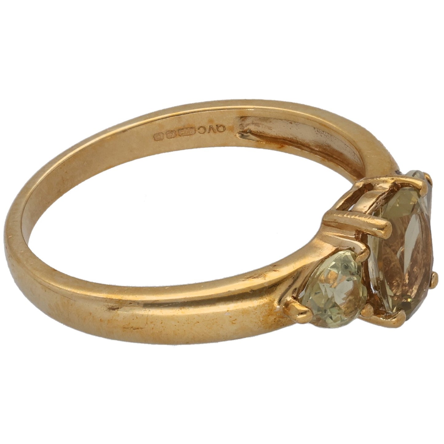 Gold three-stone quartz ring, angled view with two faceted stones and oval center