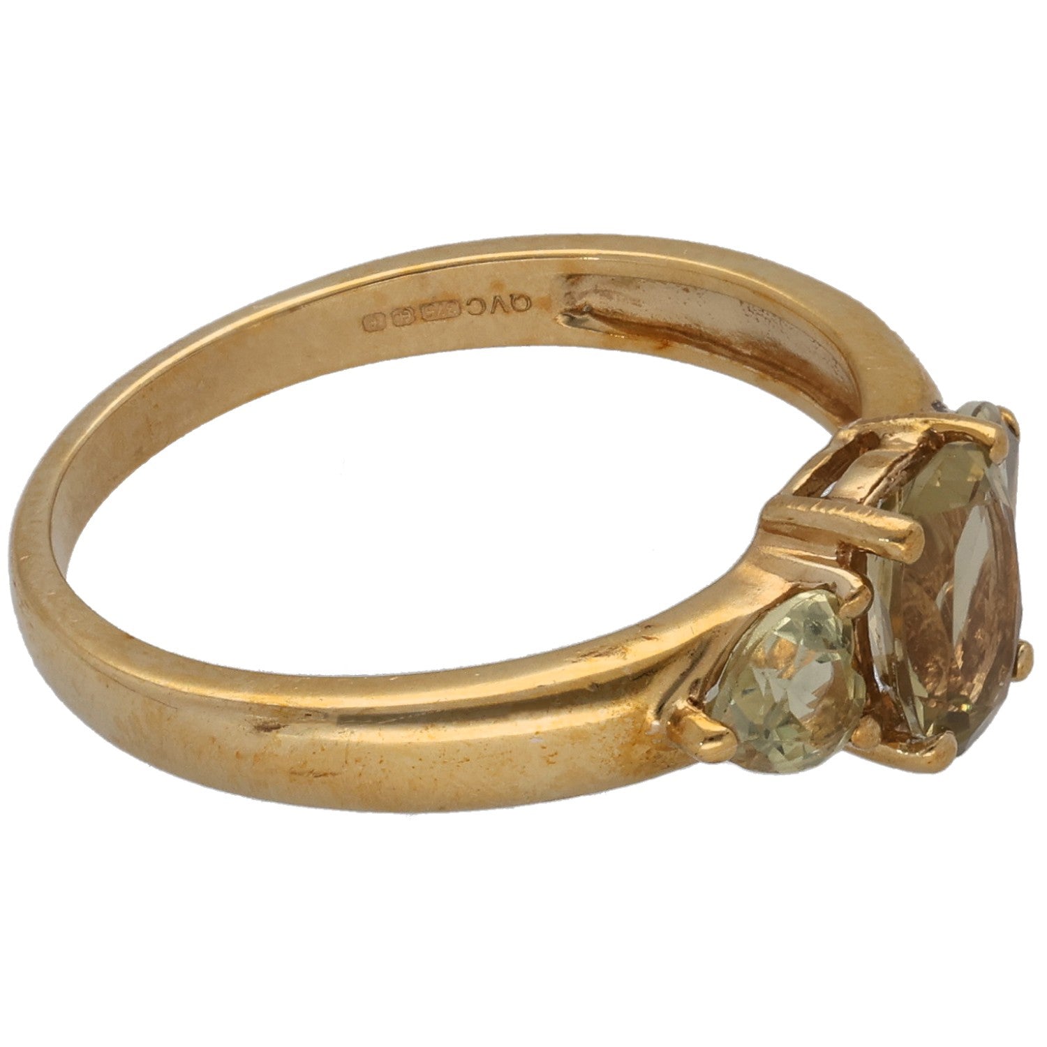 Gold three-stone quartz ring, angled view with two faceted stones and oval center
