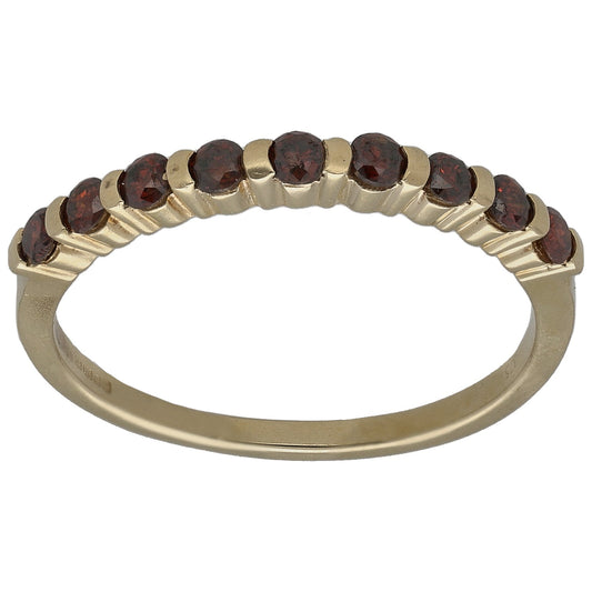 9ct gold half eternity ring with round dark stones across top band