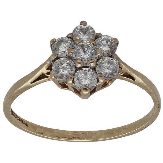 Gold CZ cluster ring with five large round stones, prong-set in a halo.