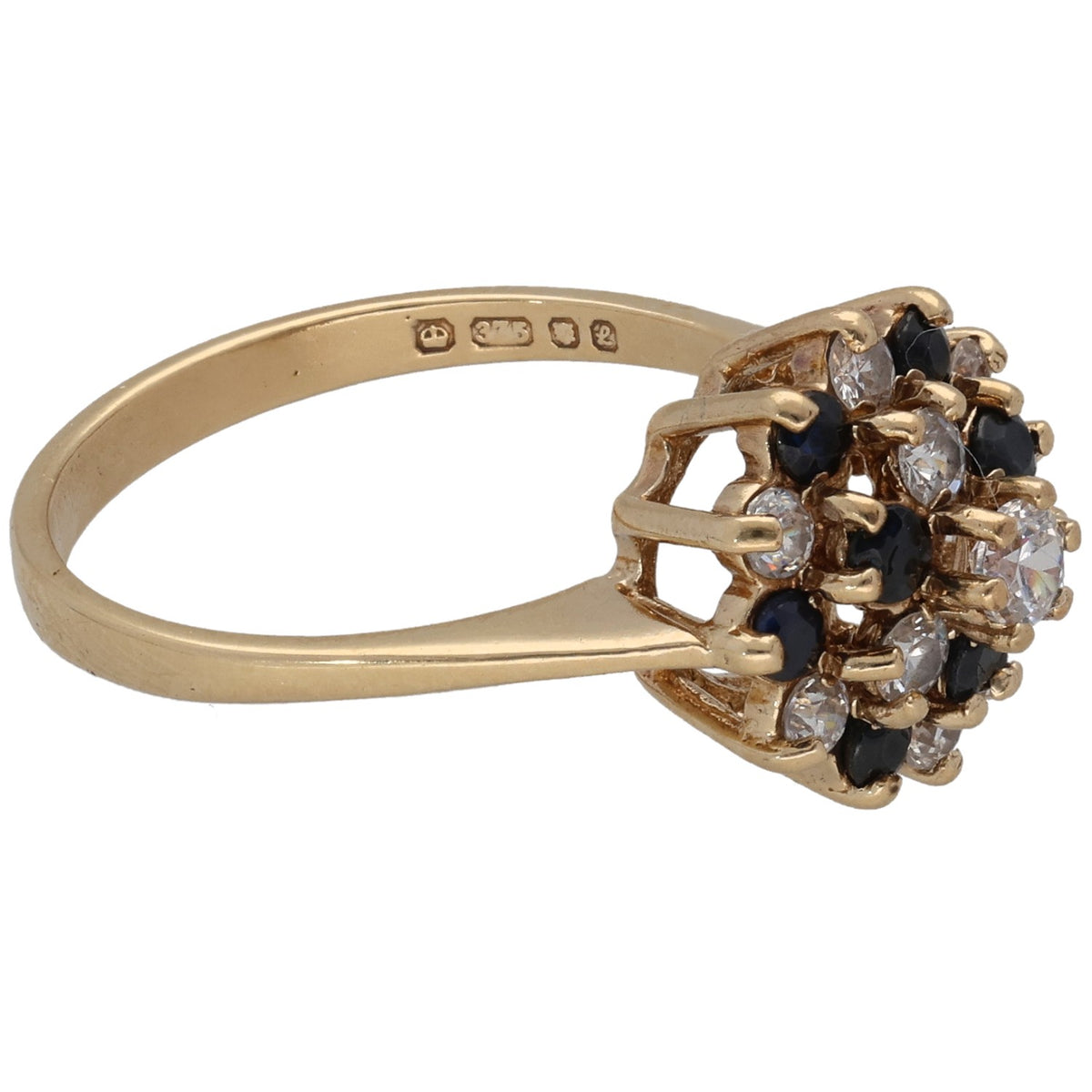 Gold ring side view with open band and CZ and dark stone cluster