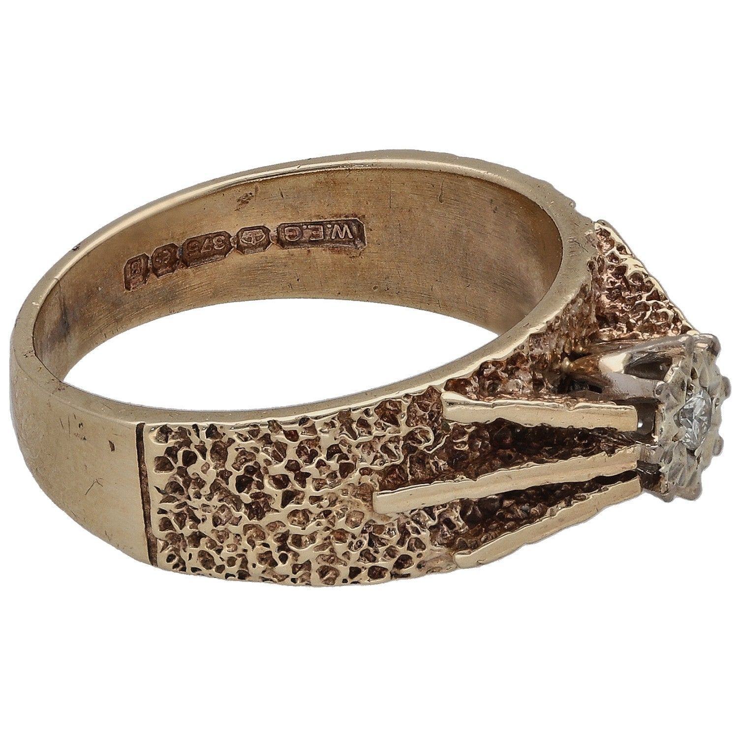 9ct gold ring with textured band and round diamond on edge, inner hallmark visible