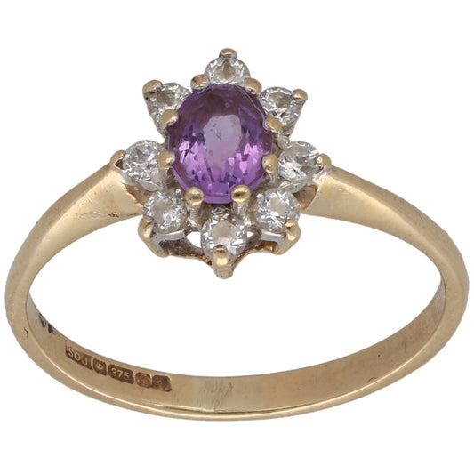 9ct gold cocktail ring with oval purple center and clear stone cluster