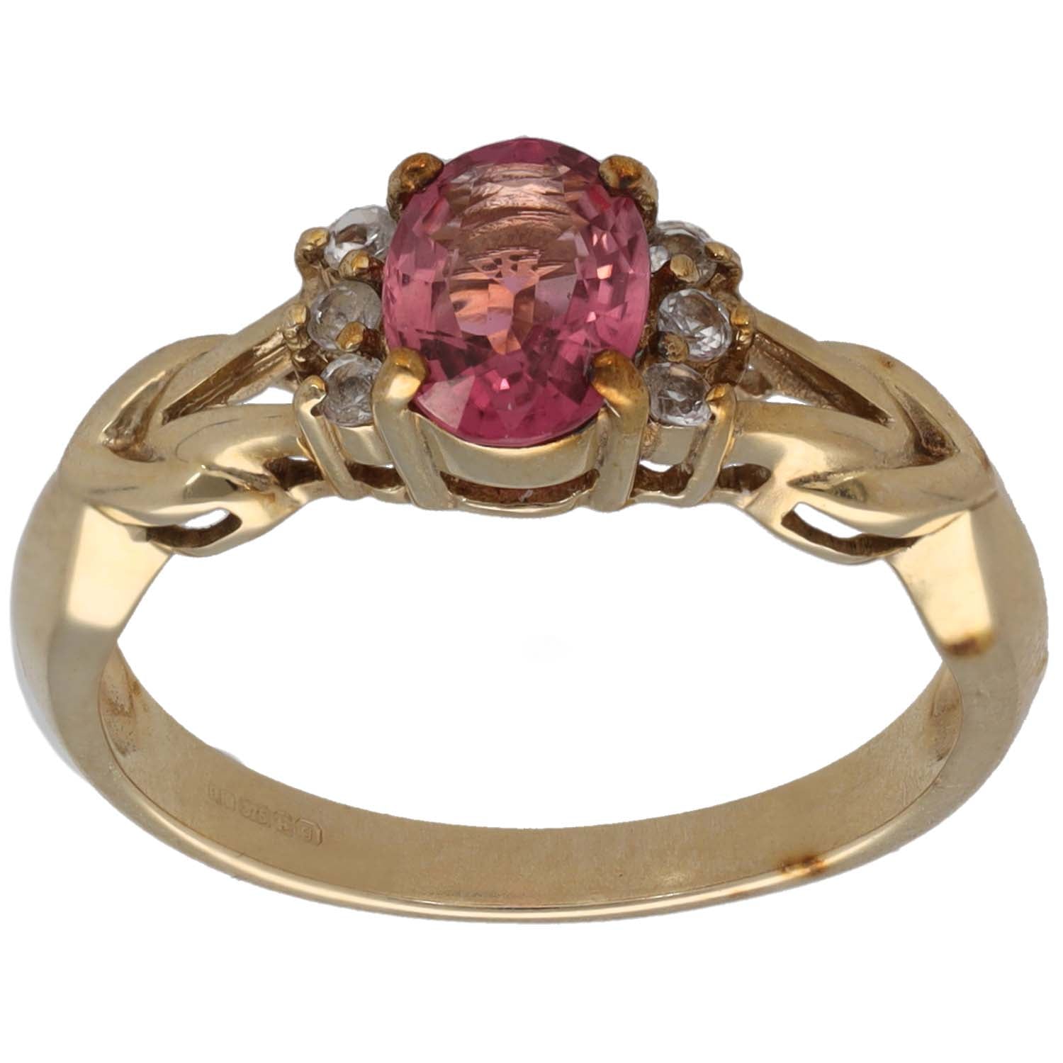 Gold cocktail ring with oval pink gemstone and clear stone clusters, size M