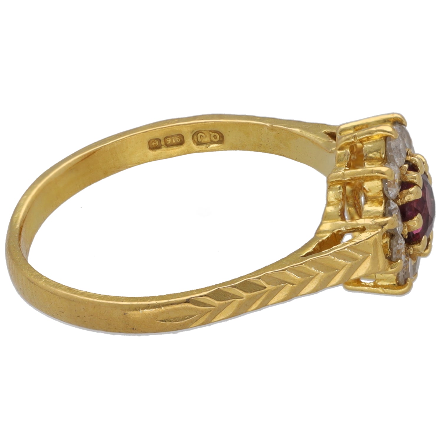 Gold band cocktail ring with raised maroon center stone and clear side CZ accents