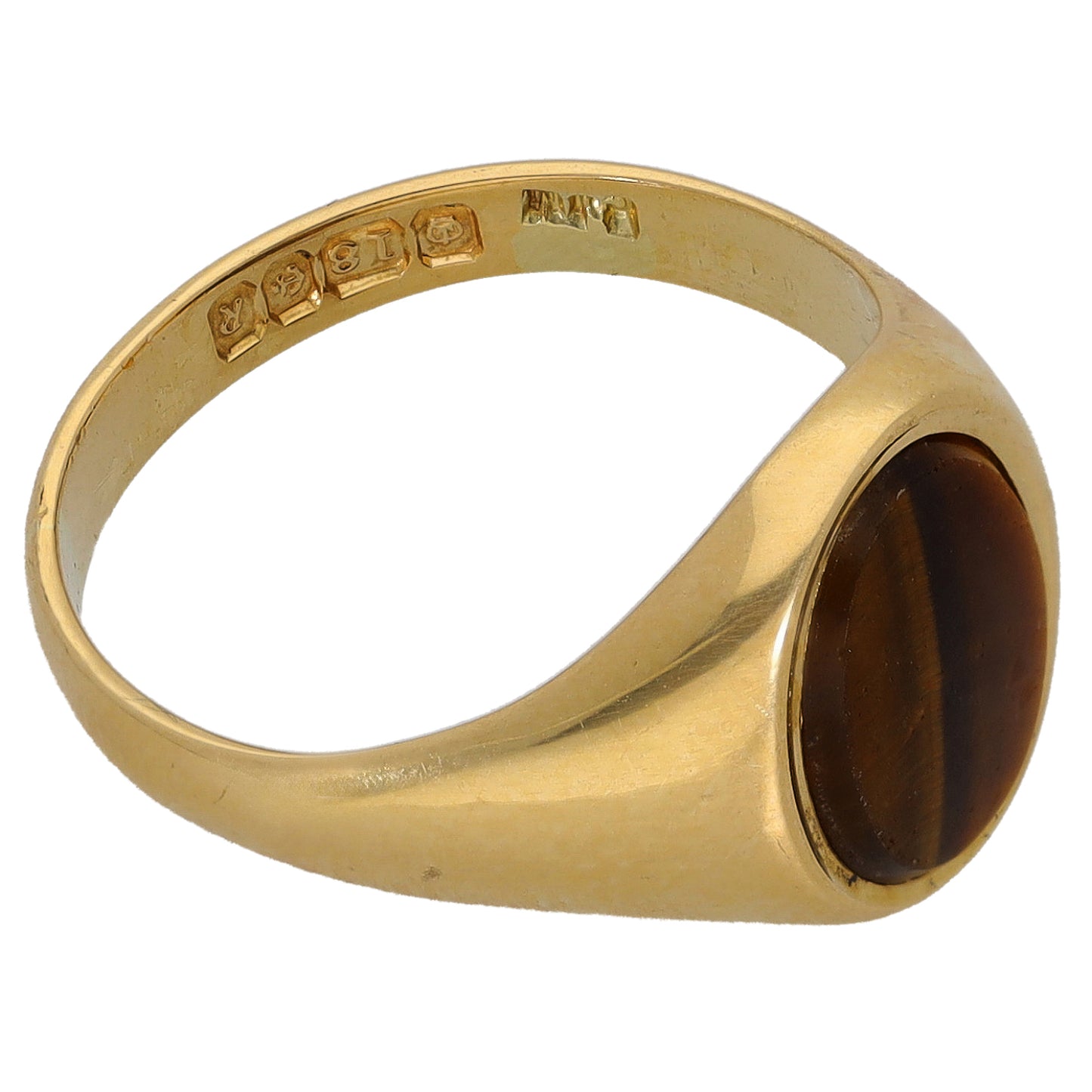 Gold single-stone ring with oval tiger-eye cabochon on the side, smooth band