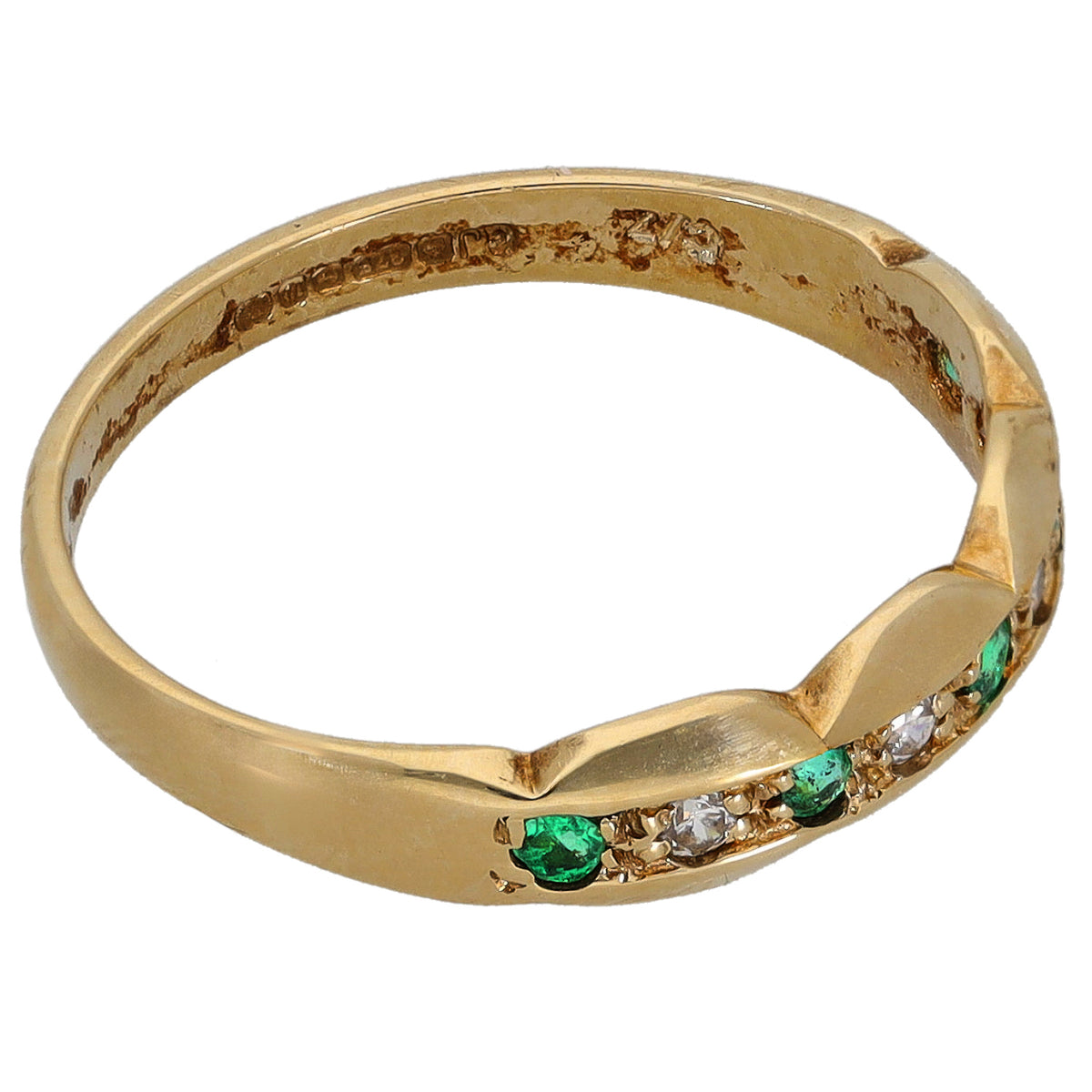 Gold half eternity ring with green emerald-cut stones and clear cubic zirconia accents