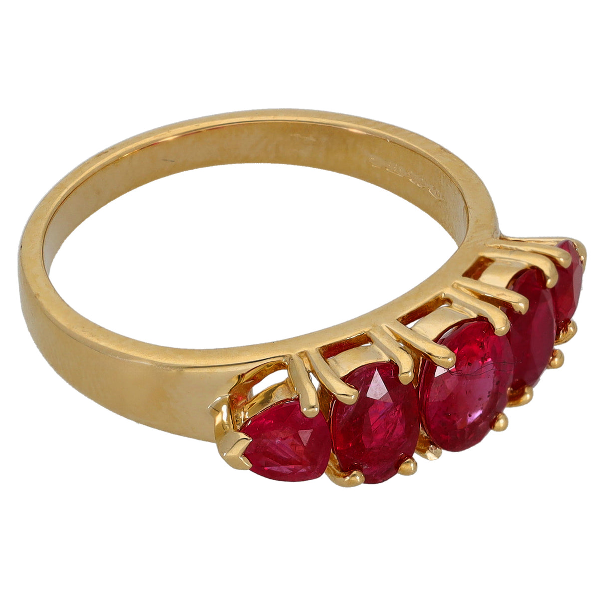 Gold half eternity ring with red ruby-style gemstones along the band