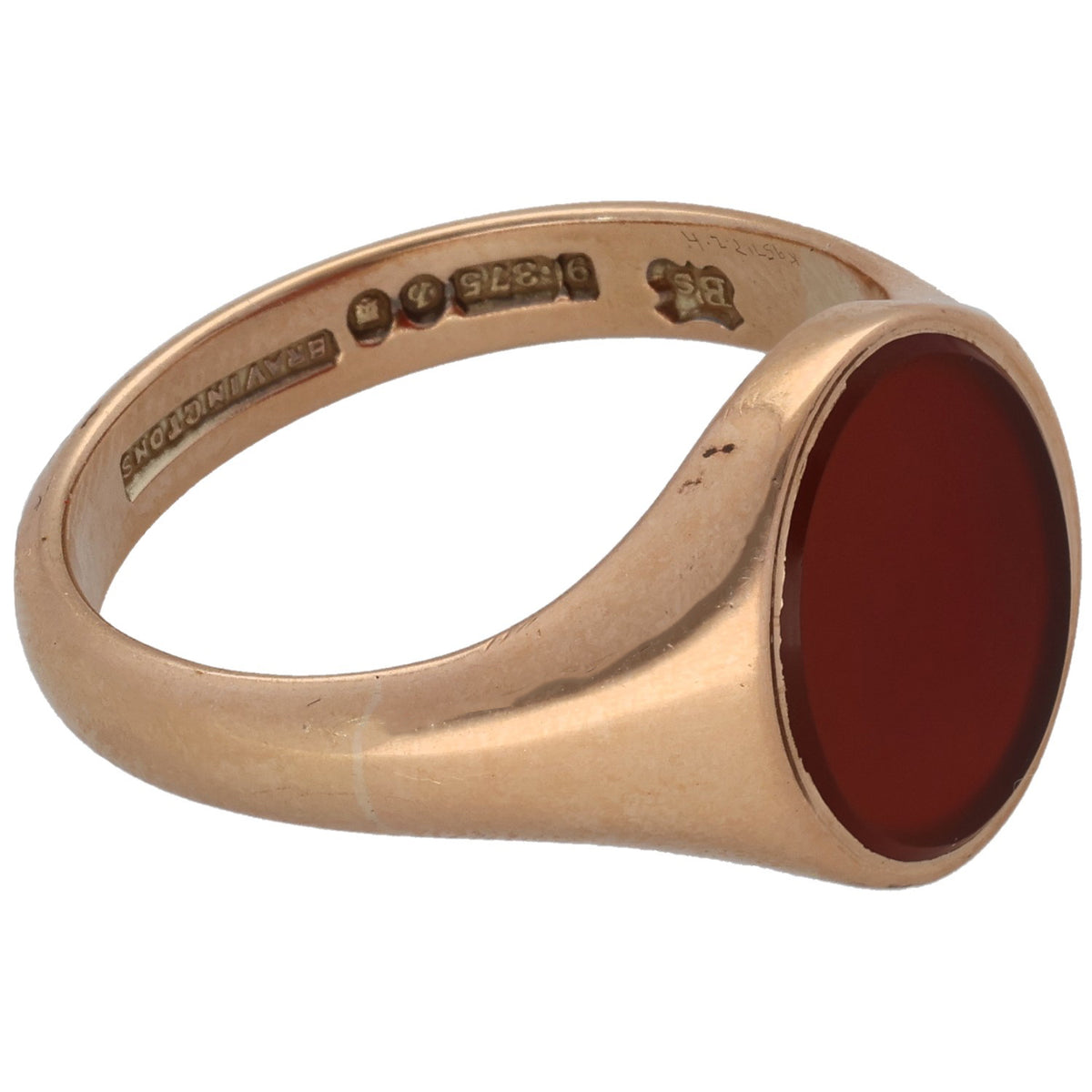 Gold signet ring with oval red carnelian stone; inner band has engraved marks