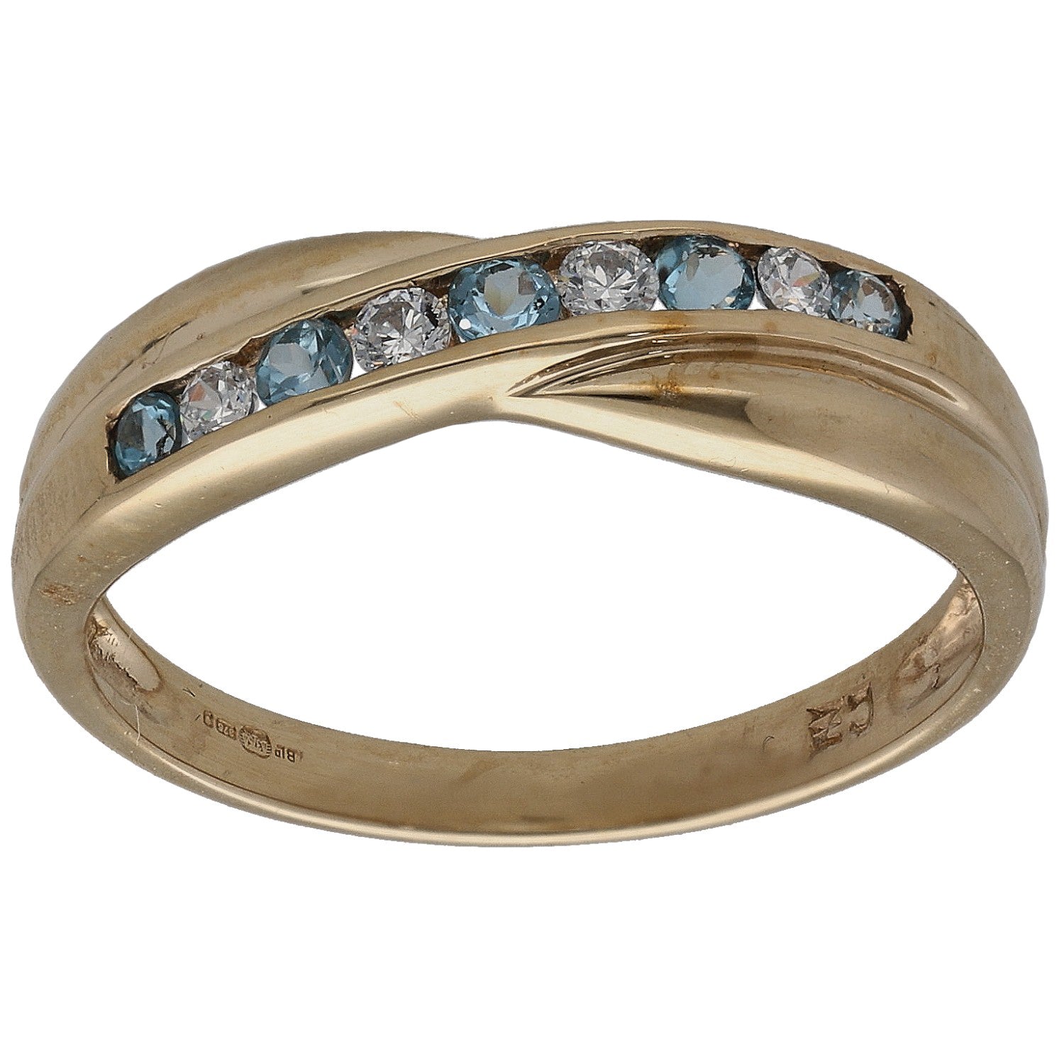 Gold cocktail ring with blue topaz-style stones and clear CZ in a curved bezel