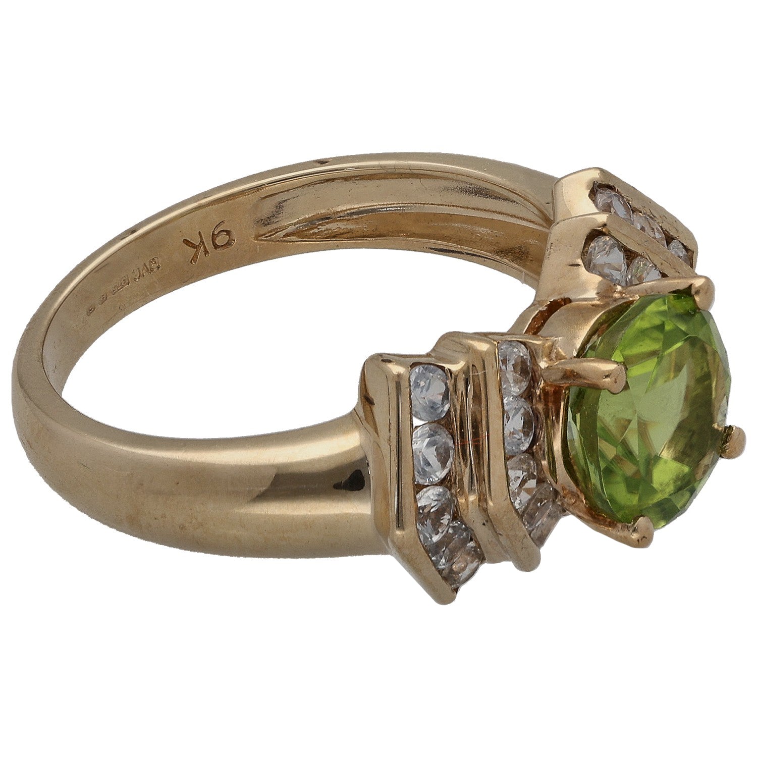 9ct gold ring with green oval center stone and three clear stones on raised setting