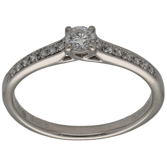 Platinum solitaire ring with round diamond and accent stones