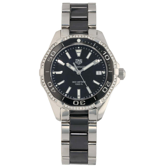 Tag Heuer Aquaracer steel watch with black dial, bezel markings, and black/metal bracelet