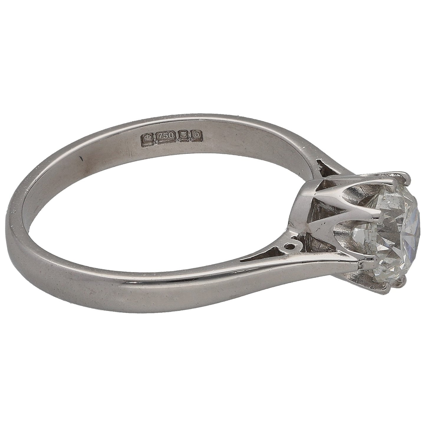White gold solitaire ring with round diamond, side angle showing band hallmarks