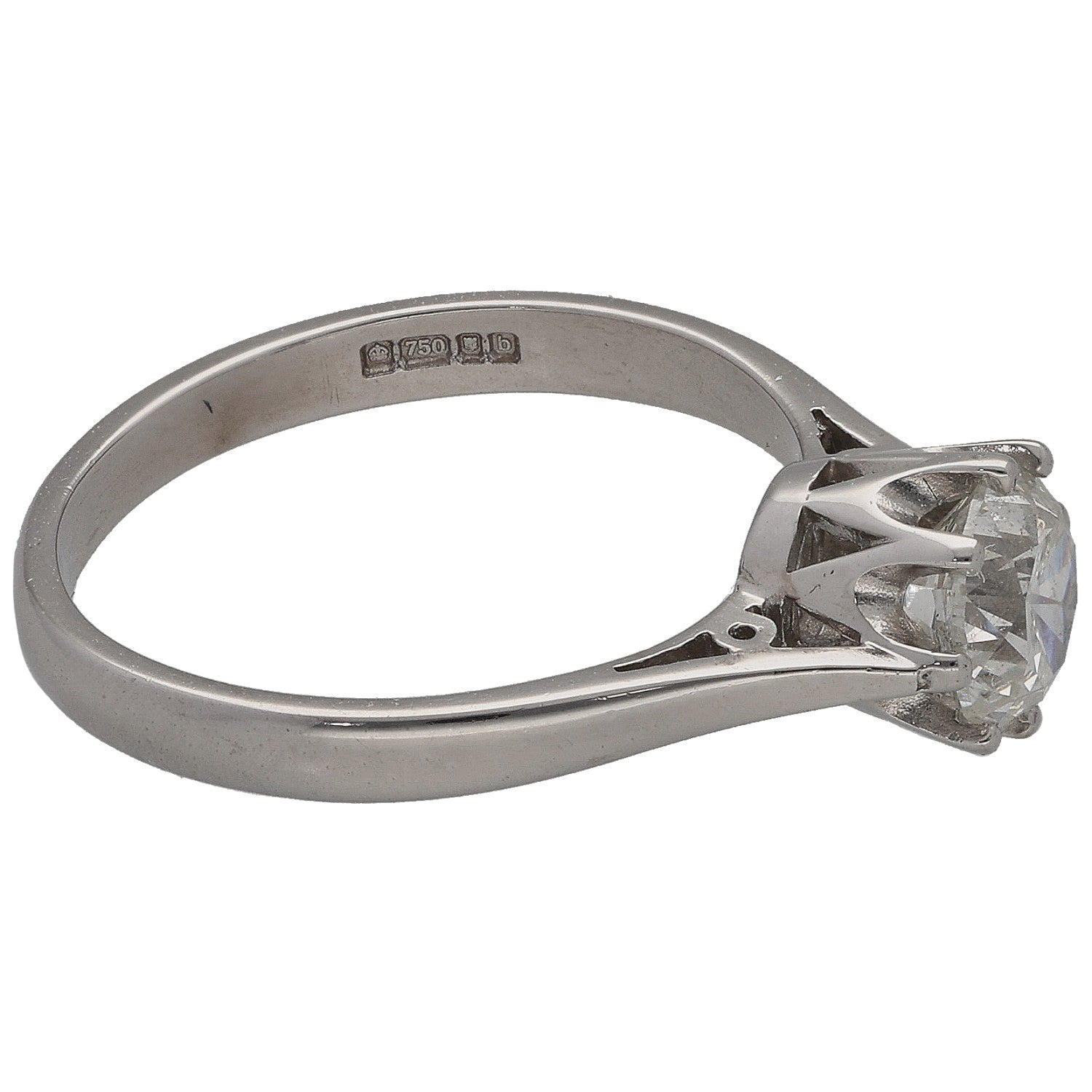 White gold solitaire ring with round diamond, side angle showing band hallmarks
